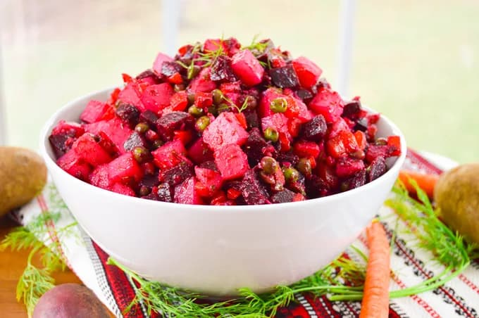 Fresh vibrant beet and cucumber salad with colorful vegetables