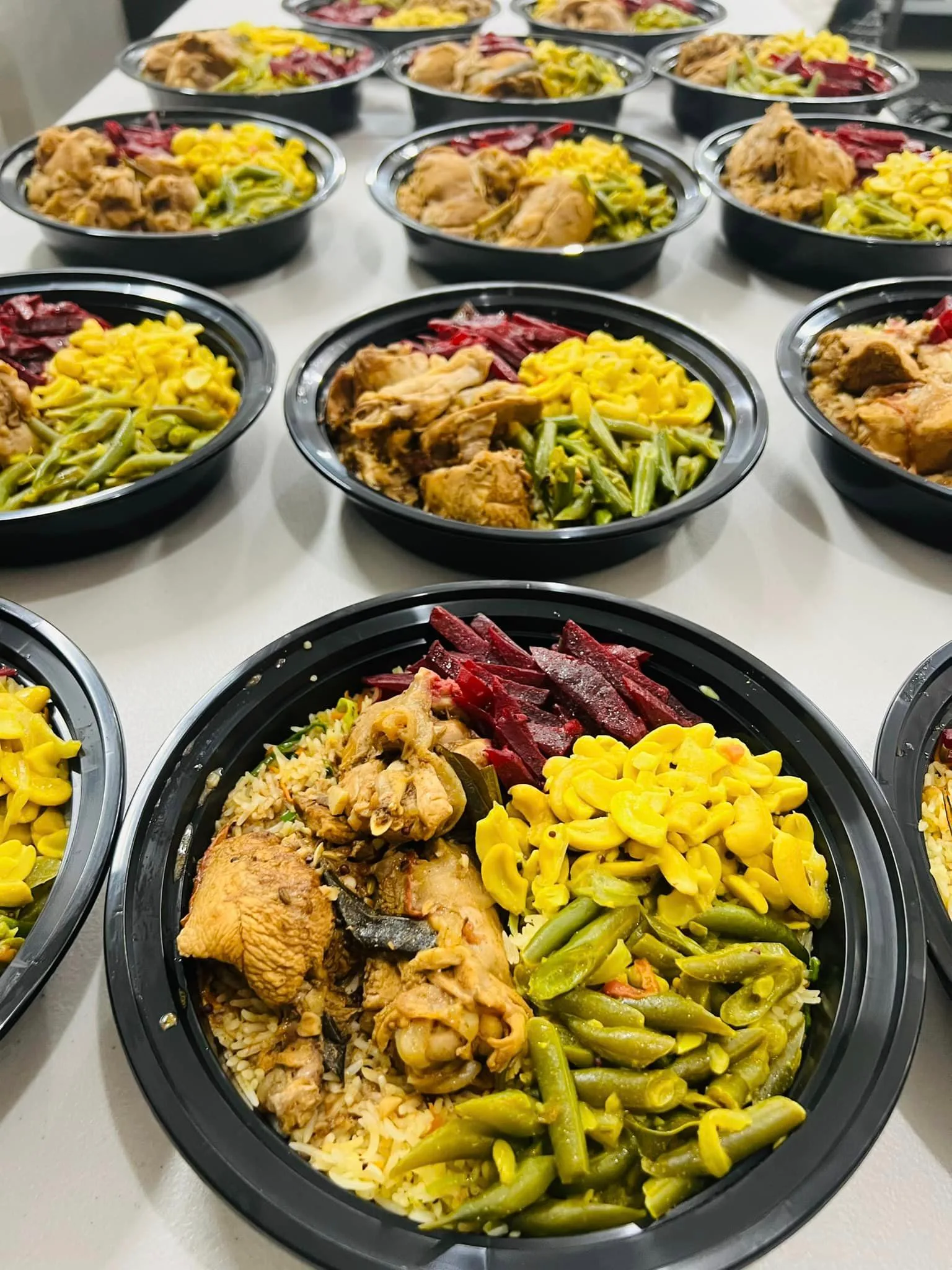 Multiple colorful Sri Lankan curry bowls arranged for corporate catering