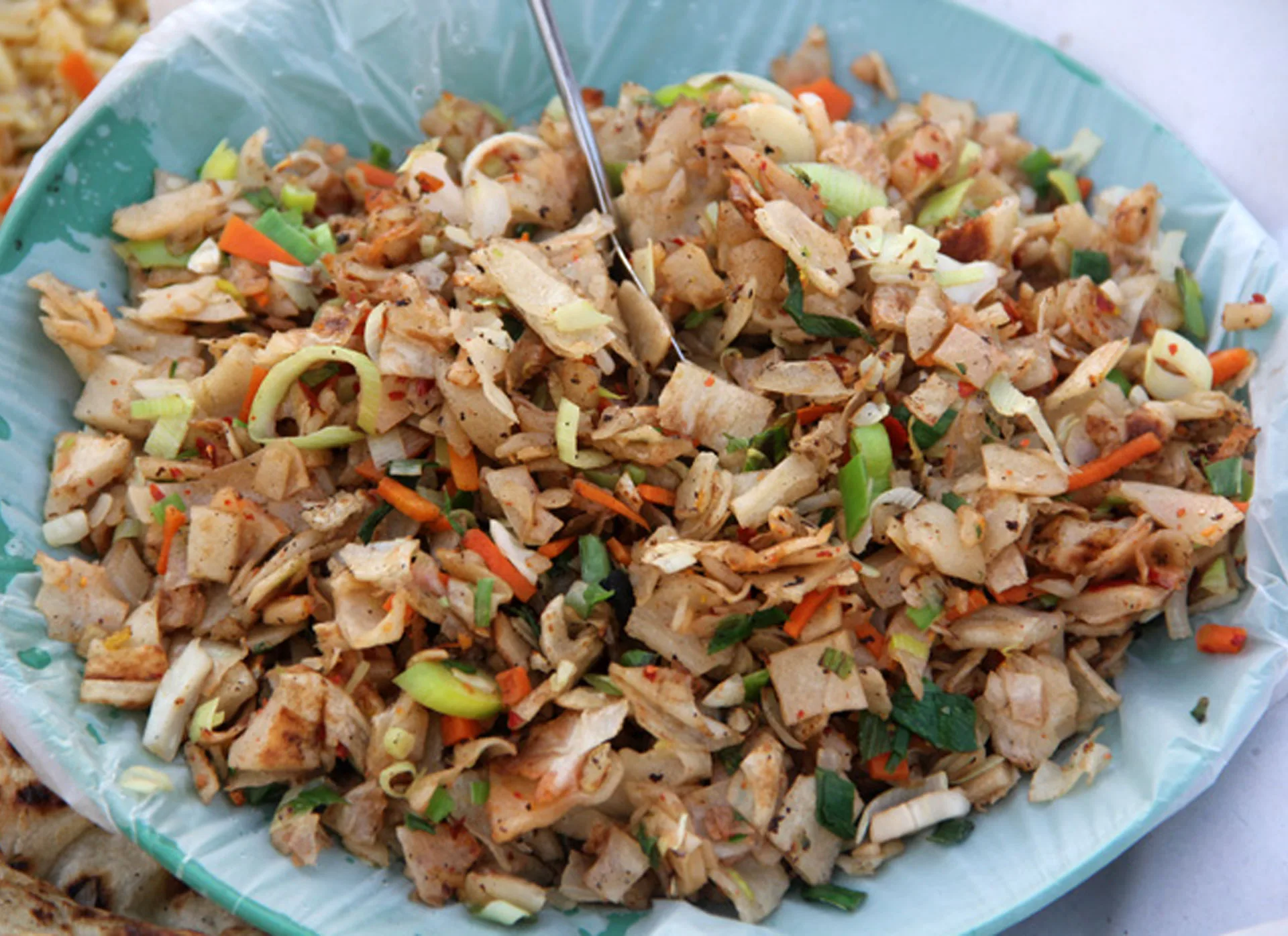 Bright colorful Sri Lankan kottu roti on serving plate